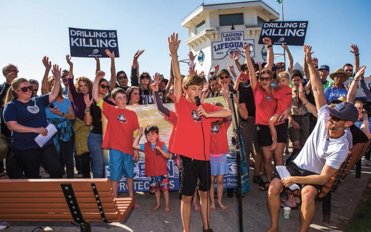 Connor Berryhill speaking at a Laguna Beach offshore drilling protest